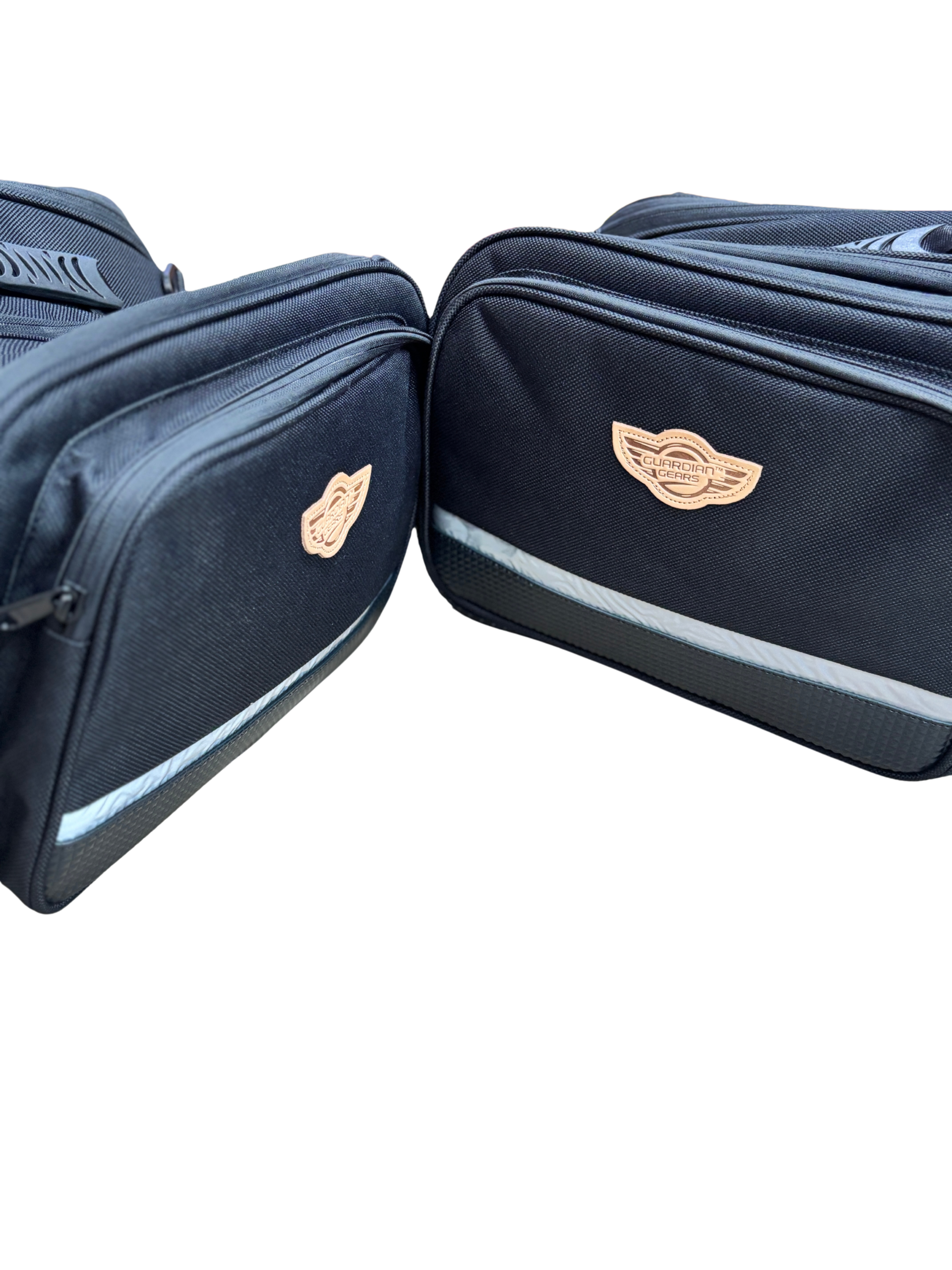 Two navy travel bags joined edge-to-edge, showing beige Guardian Angels logos on each bag.