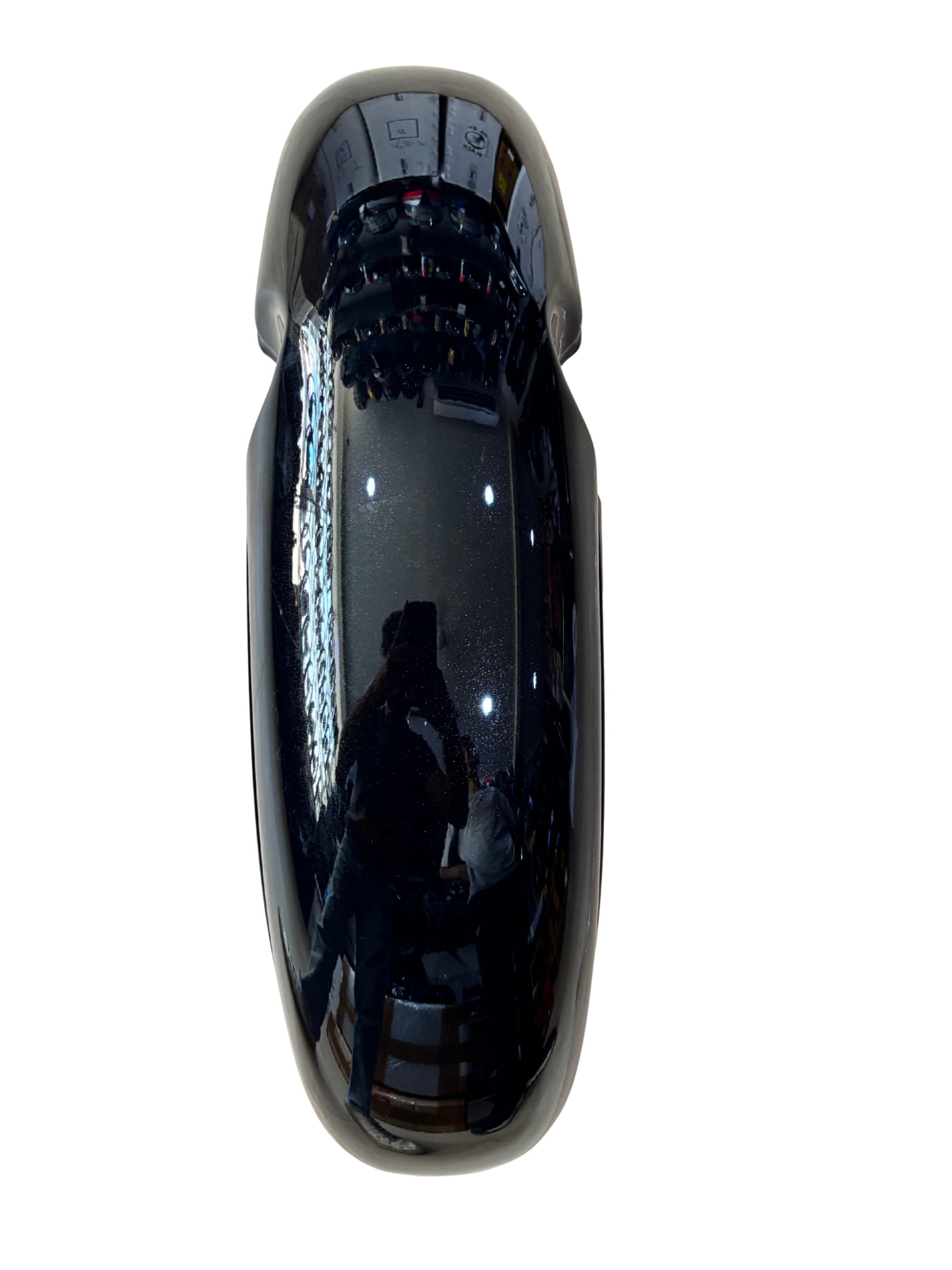 Close-up of a glossy black curved surface reflecting a person taking the photo.