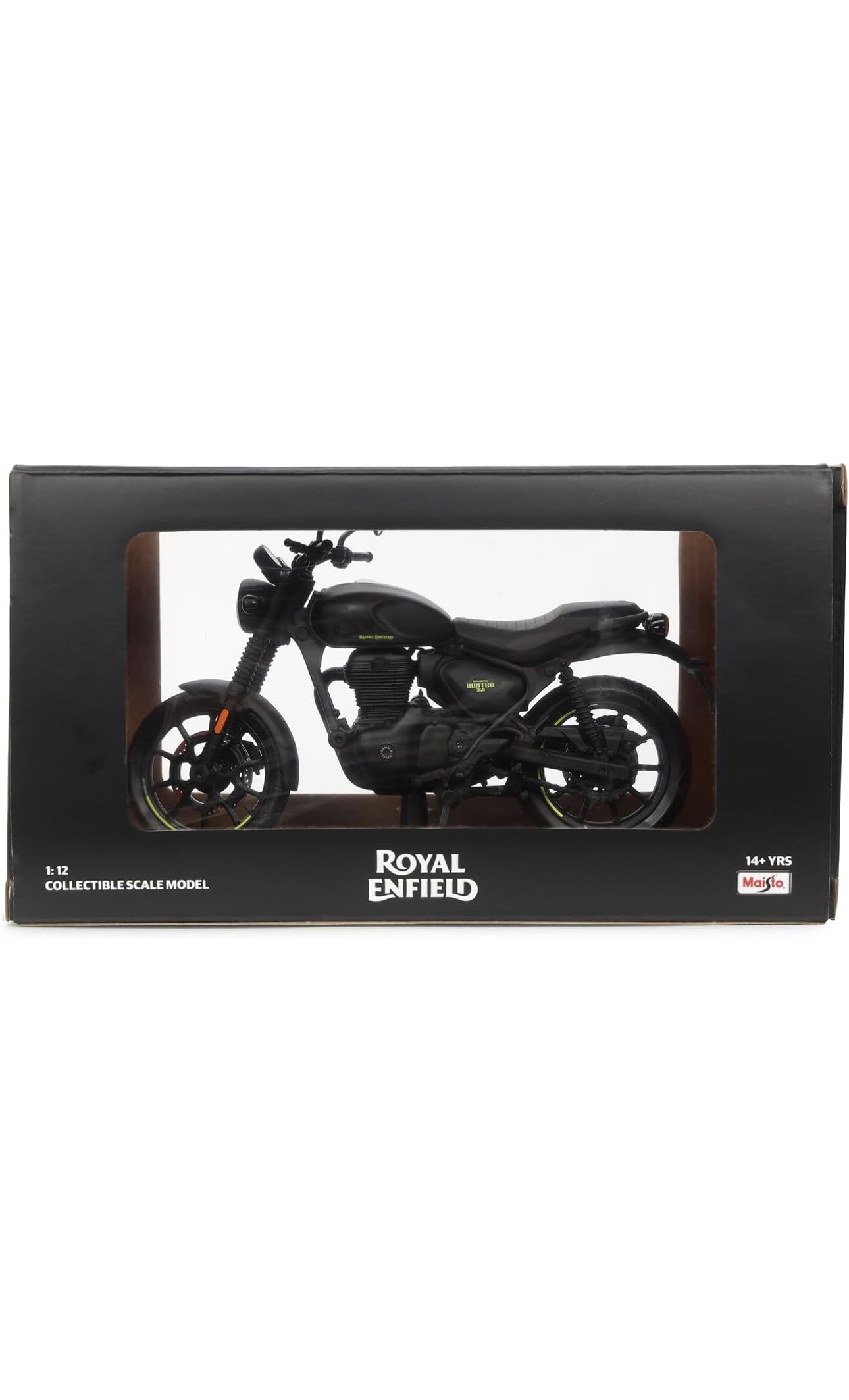 Screenshot - laxmiautocare.com Boxed 1:12 scale model of a Royal Enfield motorcycle, visible through a window display on a black package