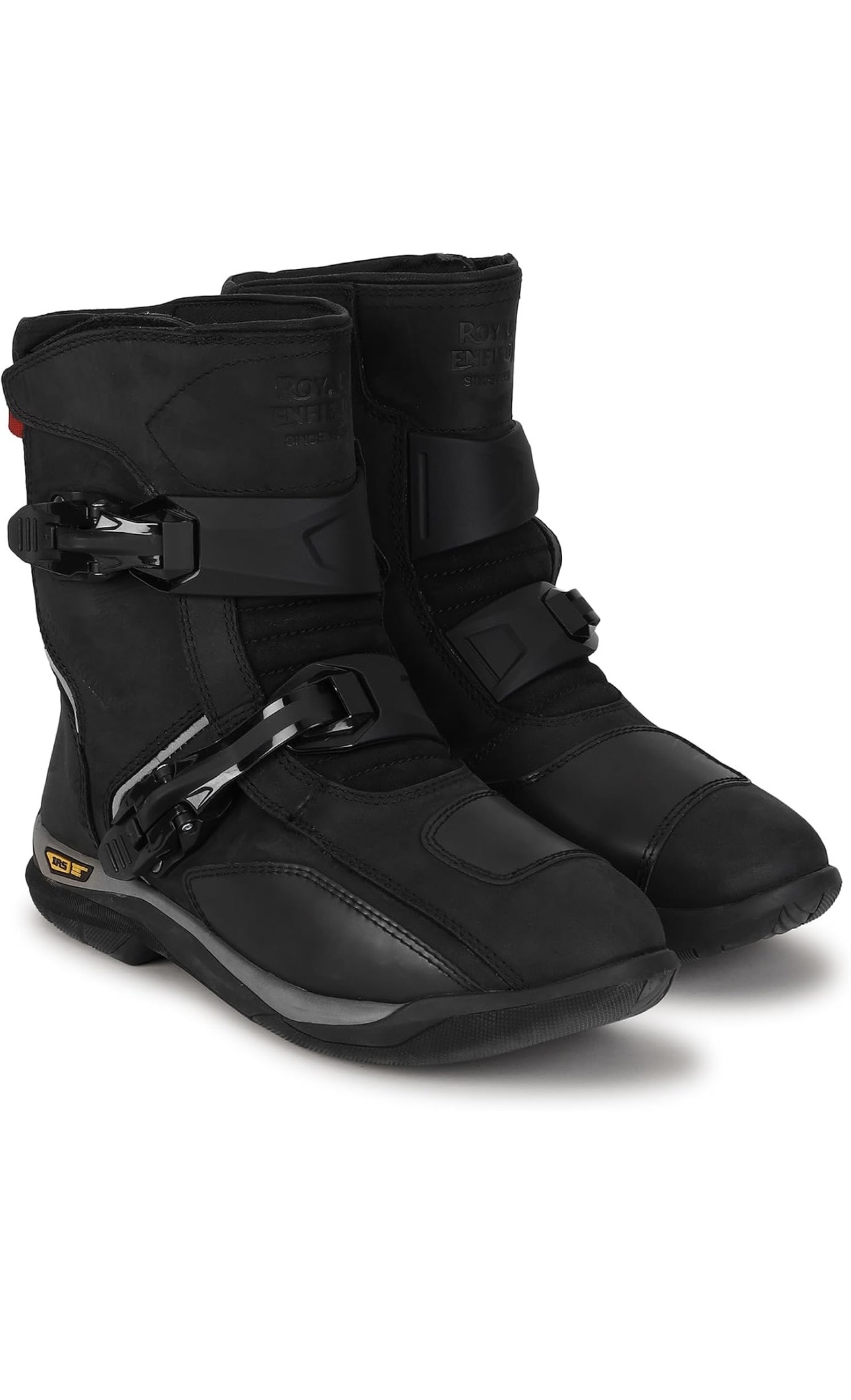 Screenshot - laxmiautocare.com Pair of black ski boots with multiple buckles and rugged sole, shown from a side angle for winter sports use.