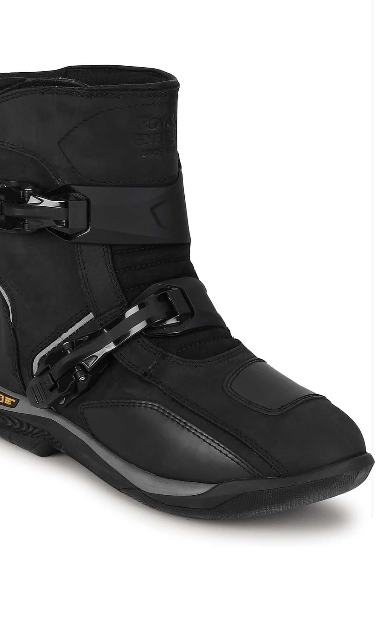 Screenshot - laxmiautocare.com Close-up of a black rugged boot showing two metal buckles and a thick sole at the heel area