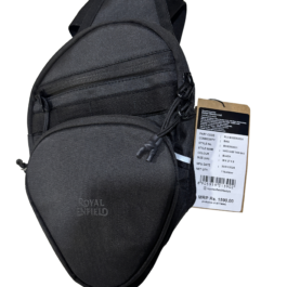 Black fabric backpack with a hanging product tag showing branding and a barcode area.