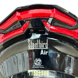 Back view of a black Steelbird helmet with a red geometric taillight panel and the 'Steelbird Air' label at the bottom center.
