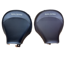 Pair of round black leather motorcycle seats with white stitch seam and the Royal Enfield logo on each seat.