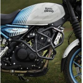 Close-up of a Royal Enfield motorcycle with a blue-and-white fuel tank bearing the Royal Enfield logo, engine guard, and blue front wheel.