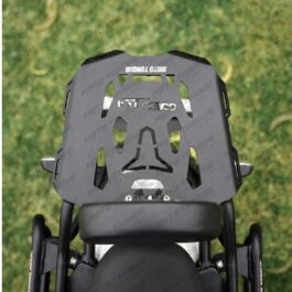 Top-down view of a gray off-road motorcycle helmet with ventilation cutouts, mounted on a bike.