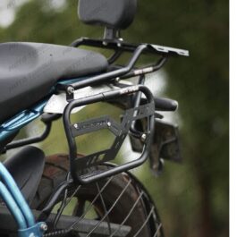 Rear cargo rack and pannier frame mounted on a motorcycle, with a small backrest above the seat outdoors