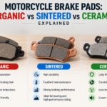 Infographic banner comparing organic, sintered, and ceramic motorcycle brake pads with their advantages and features.
